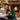 Couple sharing a personalized Interlocking Hearts necklace gift by the fireplace at Christmas โ a romantic keepsake for a wife.
