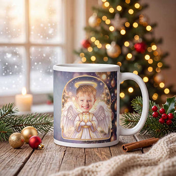 Personalized angel photo mug on a cosy Christmas table — a real face on a cute cartoon Christmas angel with halo and wings, printed both sides