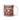 Personalized Christmas pudding photo-face mug beside a decorated tree