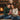 Couple sharing a personalized Forever Love necklace gift by the fireplace at Christmas โ a romantic keepsake for a wife.