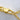 Gold cuban link chain lobster clasp closeup on marble background