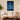 Personalized Starry Night pet memorial poster displayed in a cozy living room