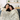Two smiling women snuggled on a sofa with a personalized Dear Mom blanket featuring a handwritten-style message on lined notebook paper design