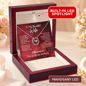 Personalized necklace in a wooden box with a built-in LED spotlight, featuring a romantic message.