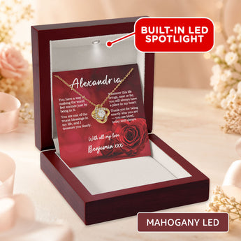 Love Knot necklace gift for her — personalized keepsake shown in a mahogany LED gift box