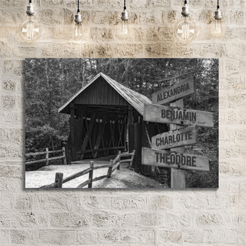 Personalized black and white covered bridge family signpost canvas with custom family names and locations