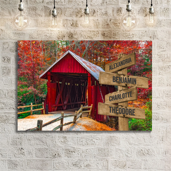 Personalized red covered bridge family signpost canvas with custom family names and locations
