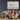 personalized farmhouse metal sign with family name hanging on living room wall above sofa with smiling parents and children
