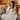 Young woman holding a yellow mug wrapped in a personalized letter to mom blanket with handwritten-style message design