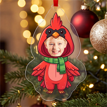 Personalized cardinal photo ornament die-cut to the cardinal shape in clear acrylic — a real face on a cute cartoon red cardinal onesie, on a red ribbon