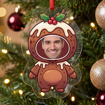 Personalized Christmas pudding photo ornament die-cut to the pudding shape in clear acrylic — a real face on a cute cartoon body, on a red ribbon