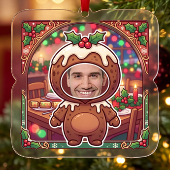 Personalized Christmas pudding ornament in clear acrylic — a real photo face on a cute cartoon Christmas-pudding body, on a red ribbon