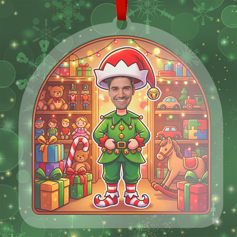 Personalized elf Christmas ornament in clear acrylic, with a photo of a real face on a cartoon elf body, hung by a red ribbon