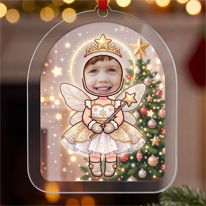 Personalized Christmas fairy ornament in clear acrylic — a real photo face on a cute cartoon fairy with a glowing halo, star tiara and wand, on a red ribbon