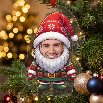 Personalized gnome photo ornament die-cut to the gnome shape in clear acrylic — a real face on a cute cartoon Christmas gnome with a big red hat and beard, on a red ribbon