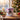 Personalized Snowman pet Christmas mug – your dog or cat's real photo face as a cute cartoon snowman with a top hat and scarf, on a snowy pastel village scene