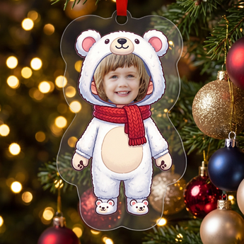 Personalized polar bear photo ornament die-cut to the polar-bear shape in clear acrylic — a real face in a cute onesie, on a red ribbon