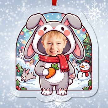 Personalized snow bunny Christmas ornament in clear acrylic — a real photo face in a cute bunny onesie, on a red ribbon