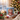 Personalized reindeer photo mug on a cosy Christmas table — a real face on a cute cartoon reindeer onesie, printed both sides