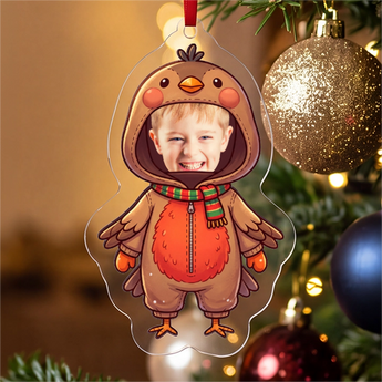 Personalized robin photo ornament die-cut to the robin shape in clear acrylic — a real face in a cute robin onesie, on a red ribbon