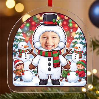 Personalized snowman Christmas ornament in clear acrylic — a real photo face on a cute cartoon snowman body with a top hat, on a red ribbon