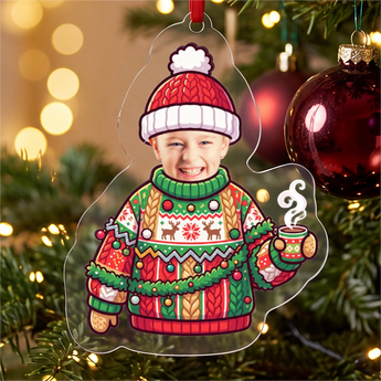 Personalized ugly Christmas sweater photo ornament die-cut to the jumper-and-hat shape in clear acrylic — a real face above a garish knitted Christmas sweater, on a red ribbon