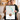 Couple holding a framed personalized Where We Met map print — a Boise, Idaho street map with a red heart marker and their photo, in a black frame.