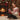 Woman opening her personalized Love Knot necklace gift by the Christmas tree — a keepsake for a sister, grandma or best friend.