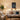 Personalized Starry Night pet memorial print displayed above a sofa in a cozy living room