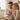 Husband giving his wife a personalized Alluring Beauty necklace in a heartfelt moment — a romantic keepsake gift for her.