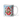Personalized cardinal Christmas photo-face mug beside a decorated tree