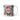 Personalized gnome Christmas photo-face mug beside a decorated tree