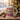 Personalized ugly Christmas sweater photo mug on a cosy Christmas table — a real face on a fun cartoon character in a festive knitted sweater, printed both sides