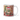 Personalized ugly Christmas sweater photo-face mug beside a decorated tree