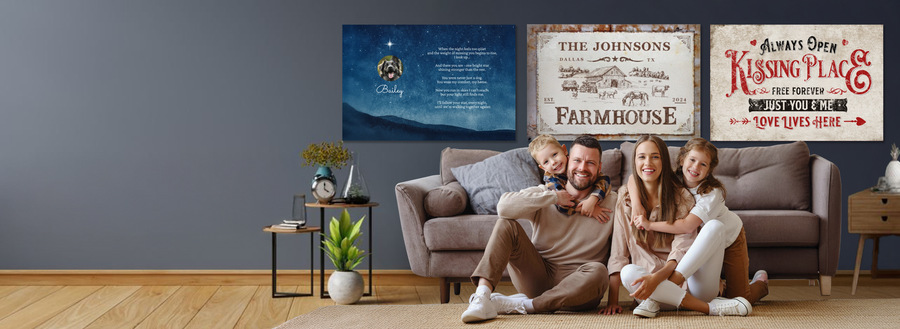 Lifestyle photo of custom wall art above a family sofa, featuring a dog memorial canvas, personalized farmhouse sign, and romantic kissing place sign