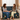 mother and daughter sitting on sofa holding hands with personalized woven blanket that says to my daughter you are your own power