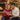 Couple sharing a personalized Eternal Hope necklace gift by the fireplace at Christmas — a romantic keepsake for a wife.