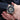 close up of luxury skeleton watch with roman numerals and black leather strap on man wrist