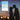Silhouette of couple about to kiss at night with framed 'Our First Kiss' New Orleans map poster in background