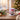 Personalized pet gnome Christmas mug on a cosy festive table beside a Christmas tree, a pet's real face inside a cute cartoon gnome hood.