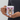 Hand holding a personalized pet reindeer Christmas mug so the pet's face design faces out.