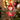 Personalized cardinal photo ornament die-cut to the cardinal shape in clear acrylic — a real face on a cute cartoon red cardinal onesie, on a red ribbon
