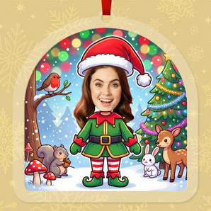 Personalized woodland elf Christmas ornament in clear acrylic, with a photo of a real face on a cartoon elf standing in snowy woods with a robin, squirrel, rabbit and deer