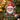 Personalized gnome photo ornament die-cut to the gnome shape in clear acrylic — a real face on a cute cartoon Christmas gnome with a big red hat and beard, on a red ribbon