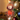 Personalized robin photo ornament die-cut to the robin shape in clear acrylic — a real face in a cute robin onesie, on a red ribbon