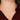 White gold love knot pendant necklace on woman in red blouse close-up